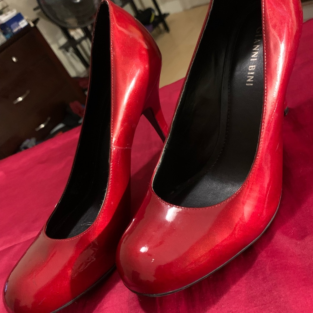 Red round toe pumps.